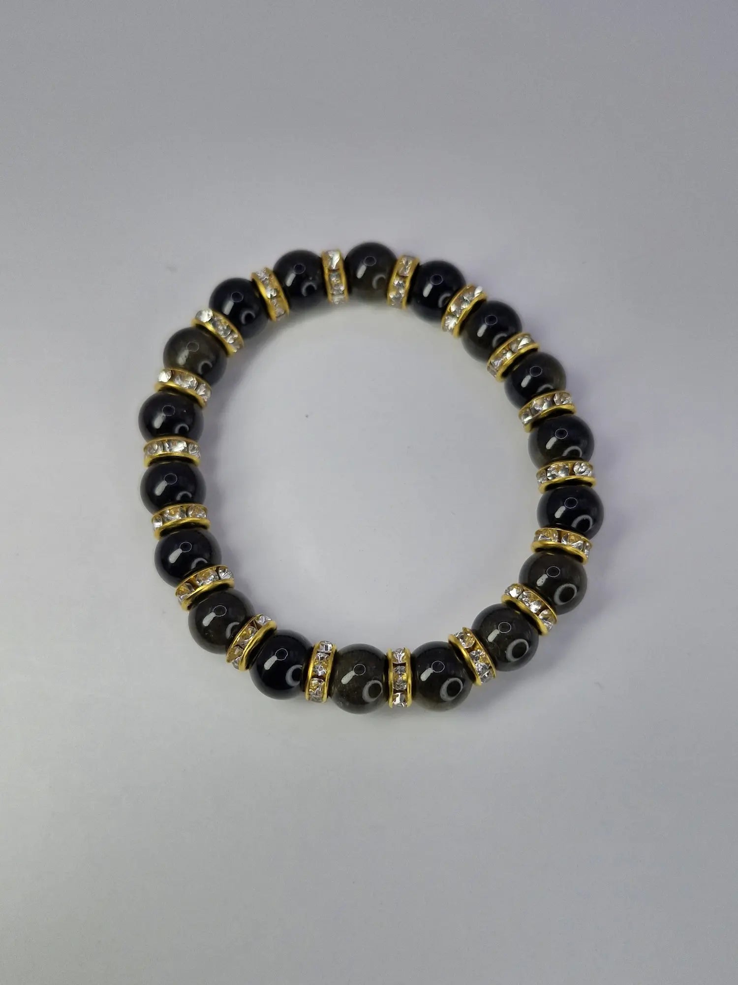 Bransoletka „Black Gold Glam” – czarna z cyrkoniami